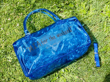 Load image into Gallery viewer, Blue &quot;Spend Da Night&quot; bag. A clear pvc bag is made of vinyl and has a zipper closure.
